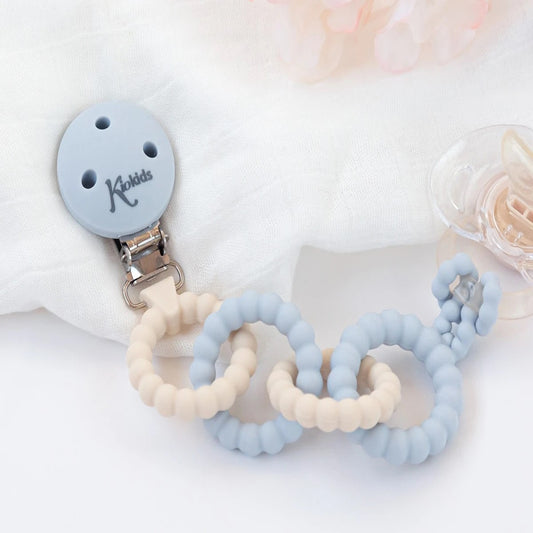 Broche de silicona azul para chupetes